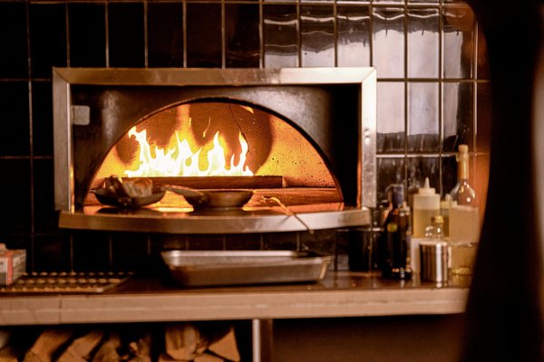 What are the key considerations for selecting an oven with a built-in steam function?